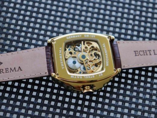 Tufina Theorema St. Petersburg GM-121-4 mechanical movement watch for men with a skeleton dial, golden rectangular case and brown leather band