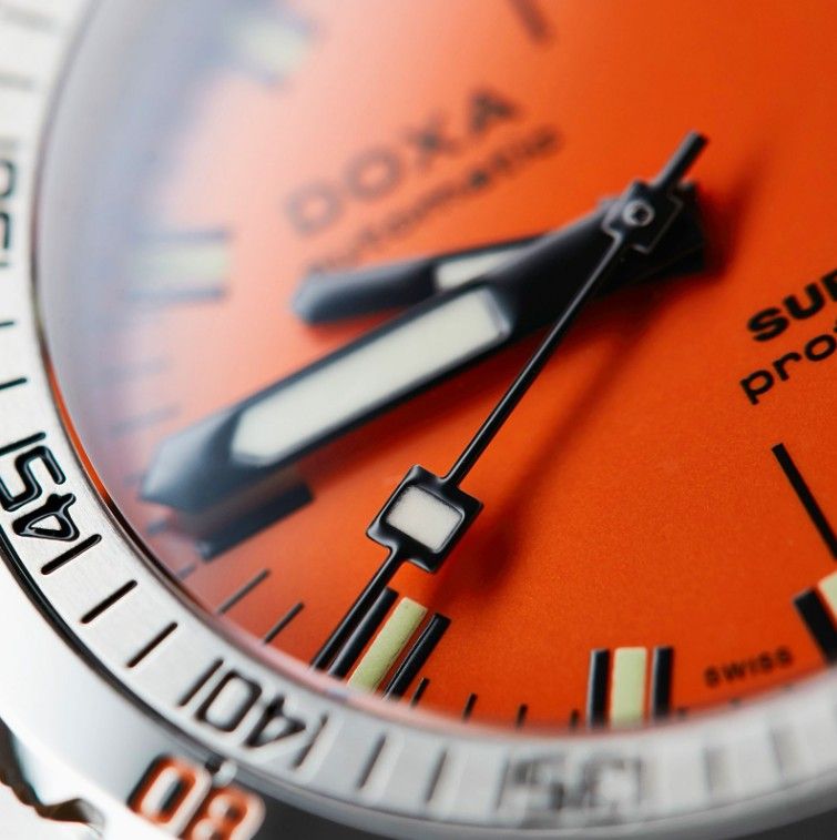 Doxa Sub 300T professional dive watch for men with an orange dial and sword hands